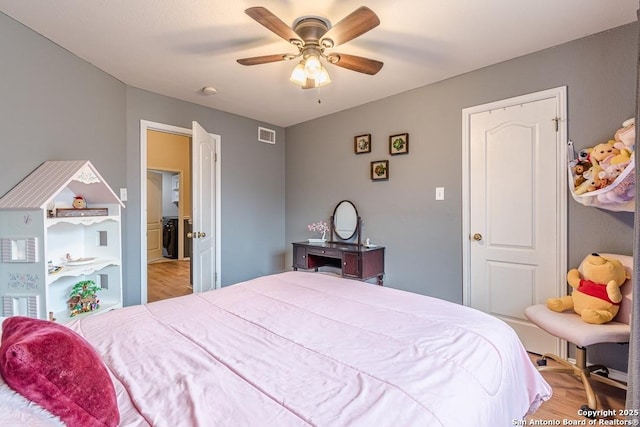 bedroom with ceiling fan and light hardwood / wood-style flooring