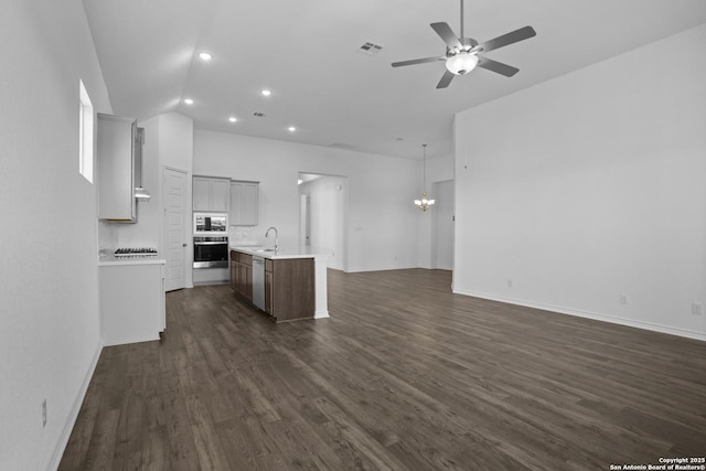 312 Hulda Trl, New Braunfels, TX 78130 - kitchen with appliances with stainless steel finishes, open floor plan, a sink, a ceiling fan, and light countertops