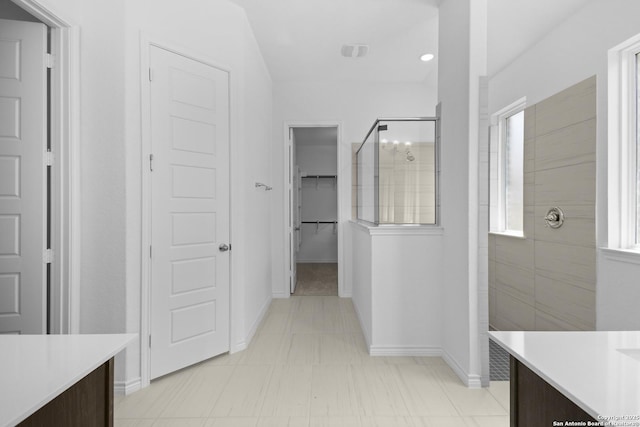 312 Hulda Trl, New Braunfels, TX 78130 - full bath featuring walk in shower, vanity, a spacious closet, and baseboards