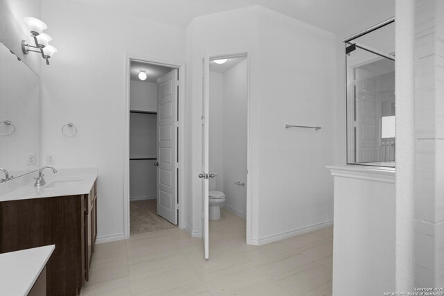 312 Hulda Trl, New Braunfels, TX 78130 - bathroom featuring vanity, toilet, baseboards, and tile patterned floors