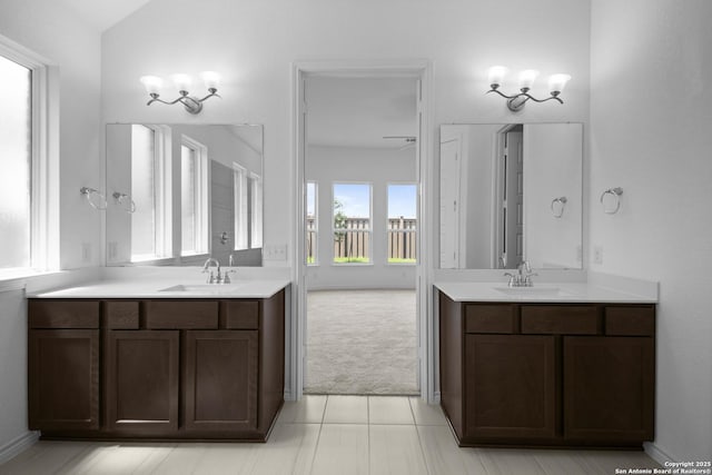 312 Hulda Trl, New Braunfels, TX 78130 - full bathroom with two vanities and tile patterned floors