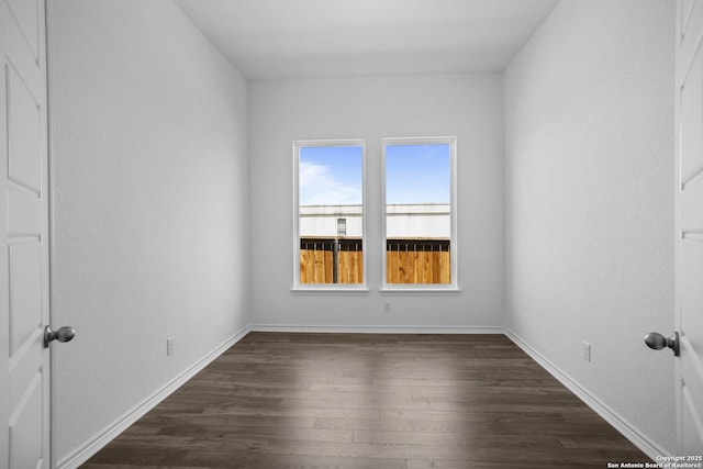312 Hulda Trl, New Braunfels, TX 78130 - unfurnished bedroom with dark wood-style floors and baseboards