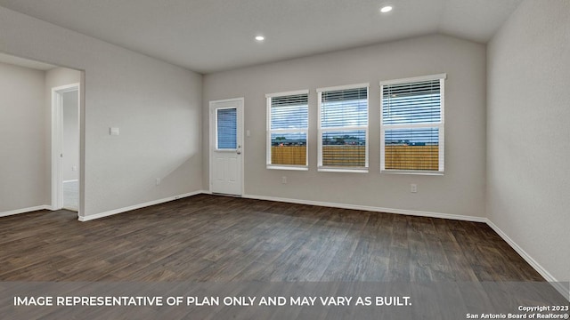 empty room with vaulted ceiling and dark wood-type flooring