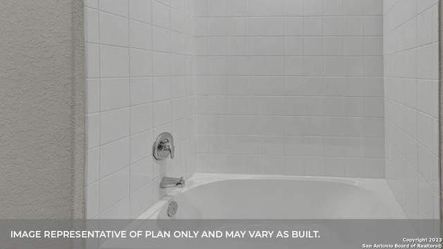 bathroom featuring tiled shower / bath combo