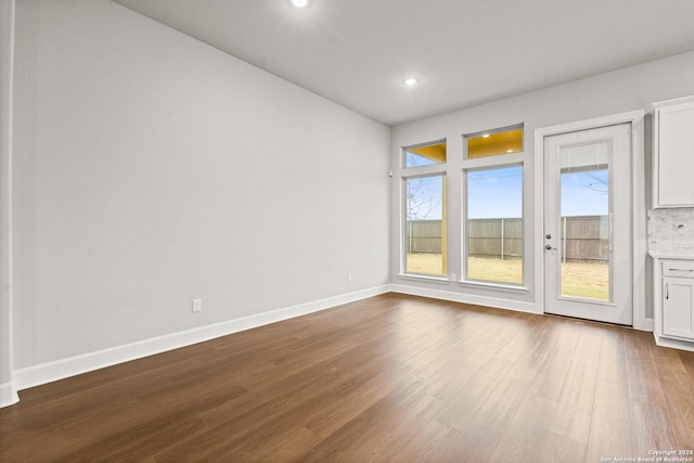 empty room featuring hardwood / wood-style flooring