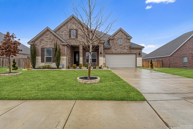 front of property featuring a garage and a front lawn