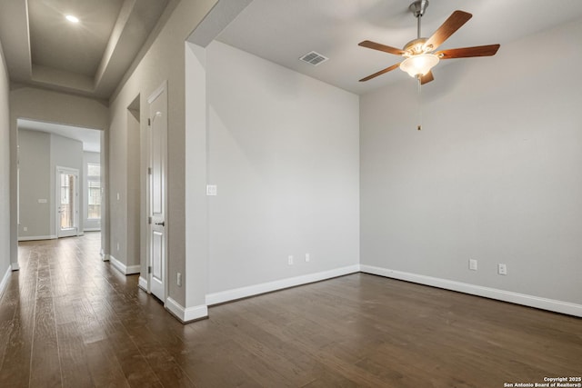 unfurnished room featuring dark hardwood / wood-style flooring and ceiling fan