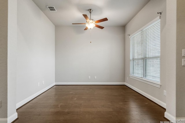 empty room featuring dark hardwood / wood-style floors and ceiling fan