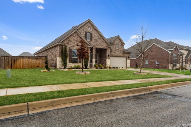 view of front of home featuring a garage and a front yard