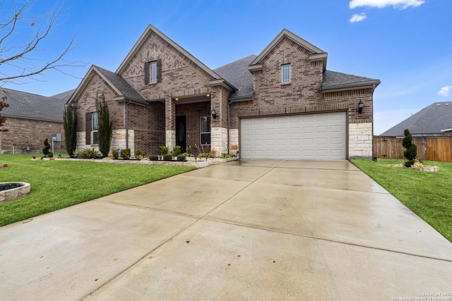 view of front of house with a garage and a front lawn