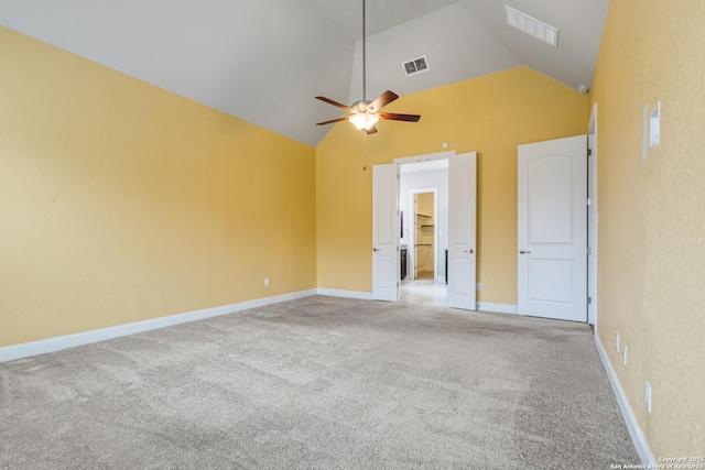 carpeted empty room featuring high vaulted ceiling and ceiling fan