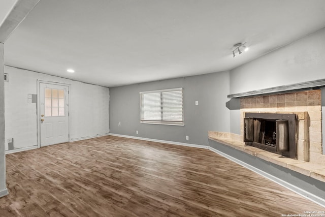 unfurnished living room with wood-type flooring