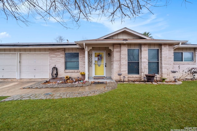 ranch-style home with a garage and a front lawn