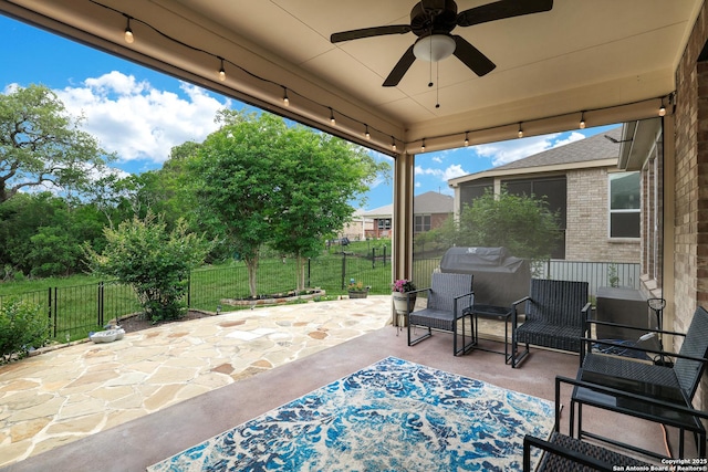 view of patio / terrace featuring fence and ceiling fan