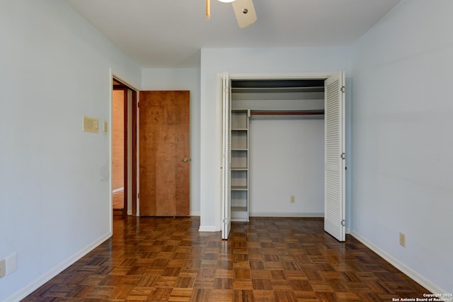 unfurnished bedroom with dark parquet flooring