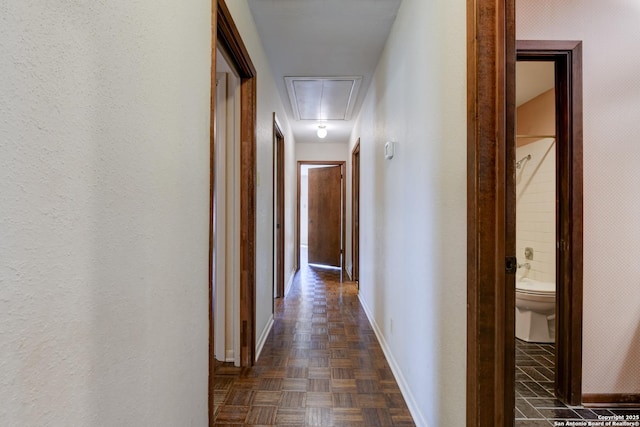 hall featuring dark parquet flooring