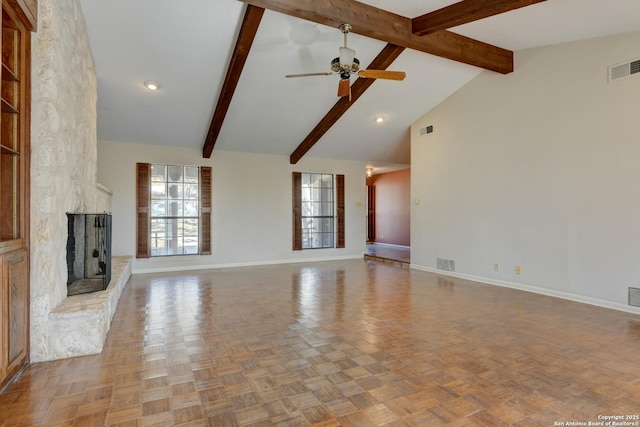 unfurnished living room featuring light parquet floors, a large fireplace, high vaulted ceiling, and beam ceiling