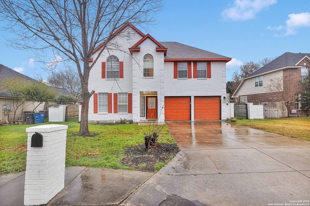 view of front of house with a garage and a front yard