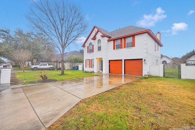 view of front facade with a garage and a front yard