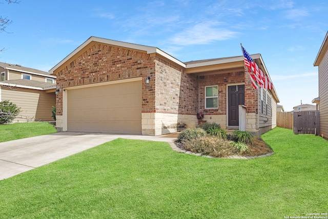 view of front of property featuring a garage and a front yard