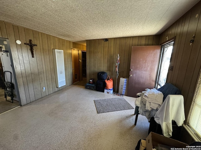 sitting room featuring wood walls