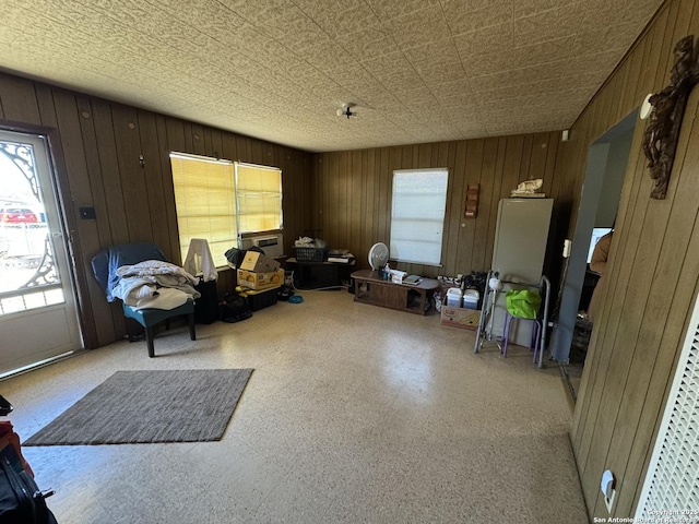 miscellaneous room featuring wooden walls