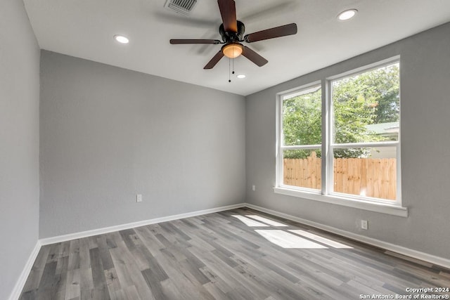 unfurnished room featuring ceiling fan and light wood-type flooring