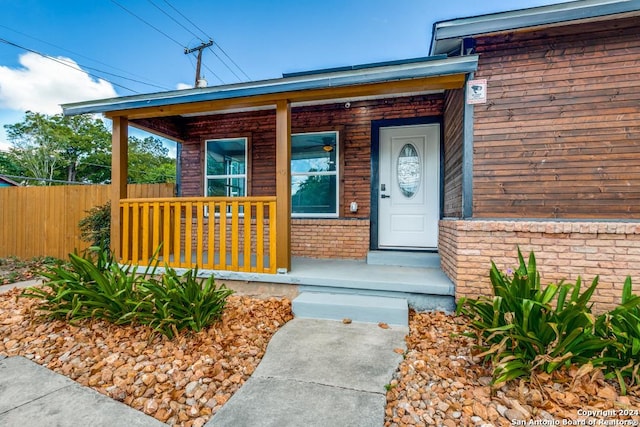 property entrance with covered porch