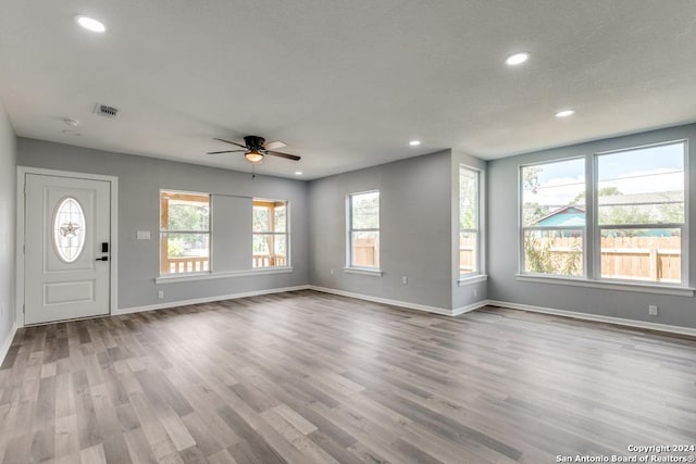 entrance foyer with ceiling fan and light wood-type flooring