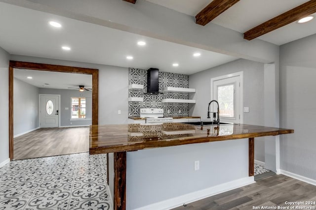 kitchen with sink, beam ceiling, a wealth of natural light, and white range with electric cooktop