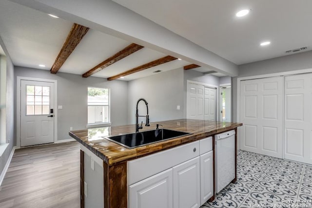 kitchen featuring white cabinetry, dishwasher, sink, a center island with sink, and beam ceiling