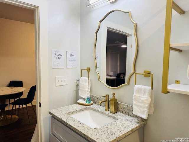 bathroom with vanity and hardwood / wood-style flooring