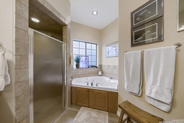 bathroom featuring independent shower and bath