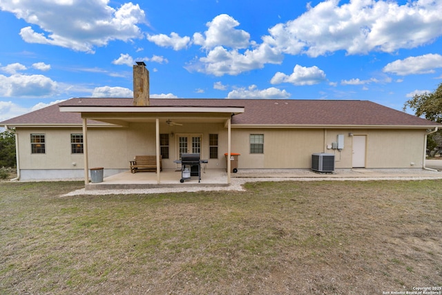 rear view of house featuring ceiling fan, a yard, a patio area, and central air condition unit