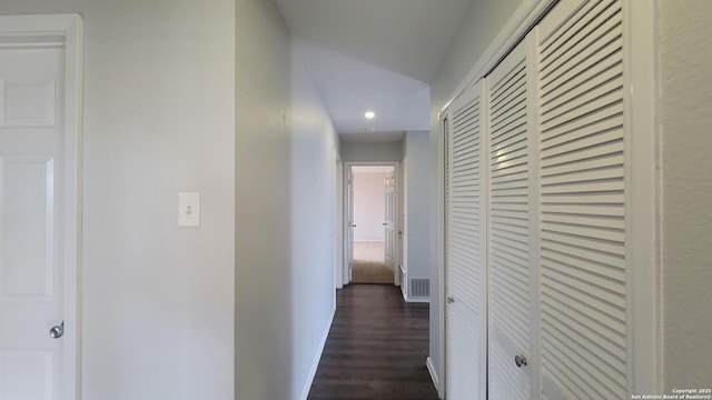 hallway with dark hardwood / wood-style floors