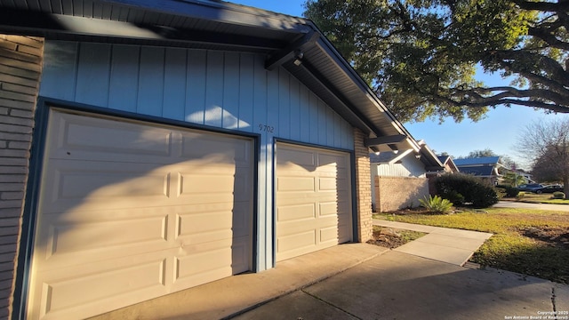 view of side of home featuring a garage