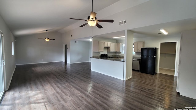 kitchen with black refrigerator, stainless steel dishwasher, dark hardwood / wood-style flooring, and dark stone counters