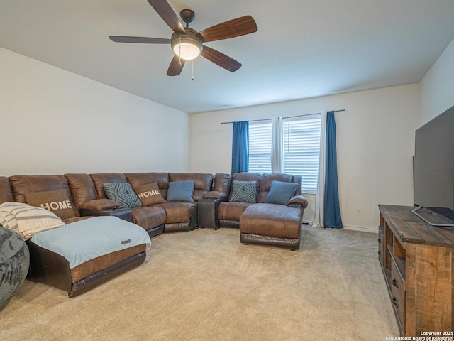 living room featuring light carpet and ceiling fan