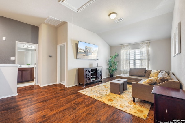 living room featuring vaulted ceiling and dark hardwood / wood-style flooring