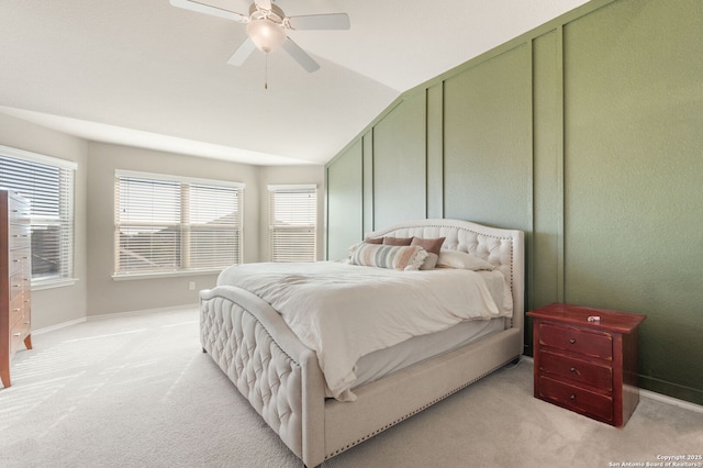 carpeted bedroom with lofted ceiling and ceiling fan