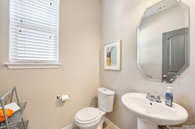 bathroom with toilet and sink