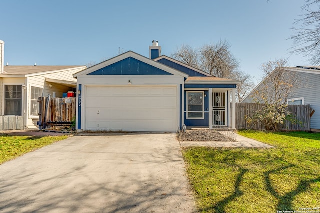 view of front of home featuring a garage and a front lawn