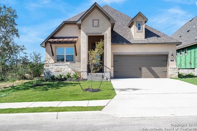 view of front of property featuring a garage, concrete driveway, stone siding, a front lawn, and stucco siding