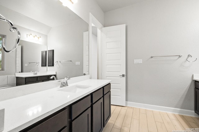 bathroom featuring wood-type flooring and vanity