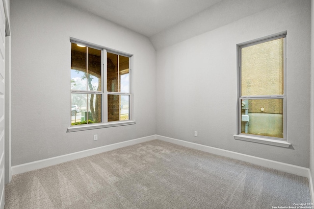 empty room featuring carpet flooring and baseboards