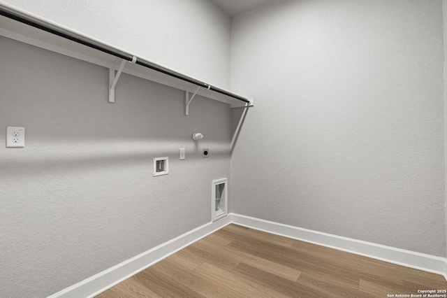 clothes washing area featuring washer hookup, hookup for a gas dryer, wood-type flooring, and electric dryer hookup