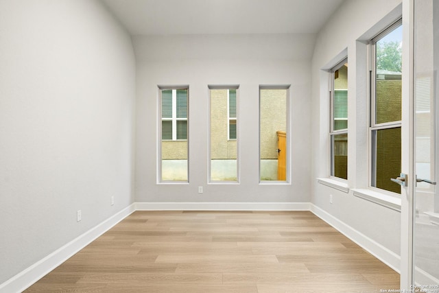 unfurnished room with light hardwood / wood-style floors