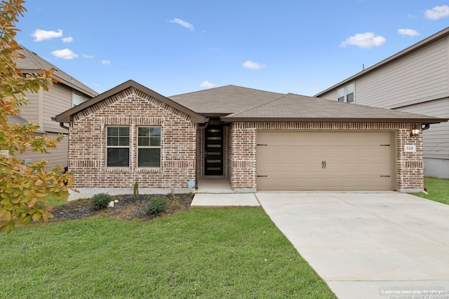 view of front of home featuring a garage and a front lawn