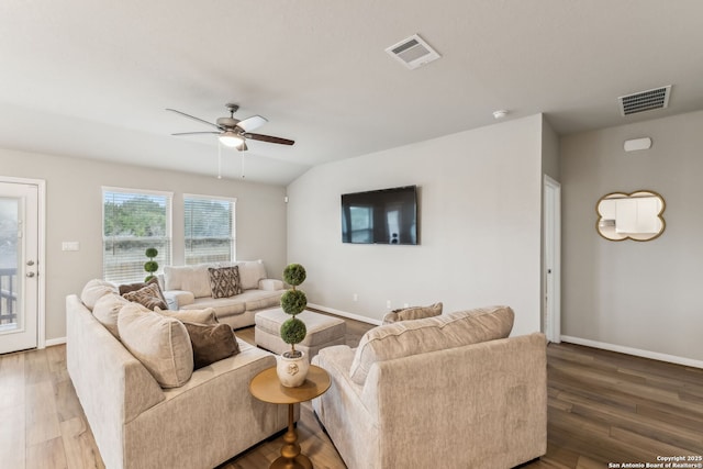 living room featuring ceiling fan and hardwood / wood-style floors