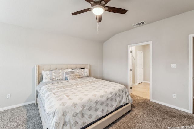 carpeted bedroom with ceiling fan and lofted ceiling